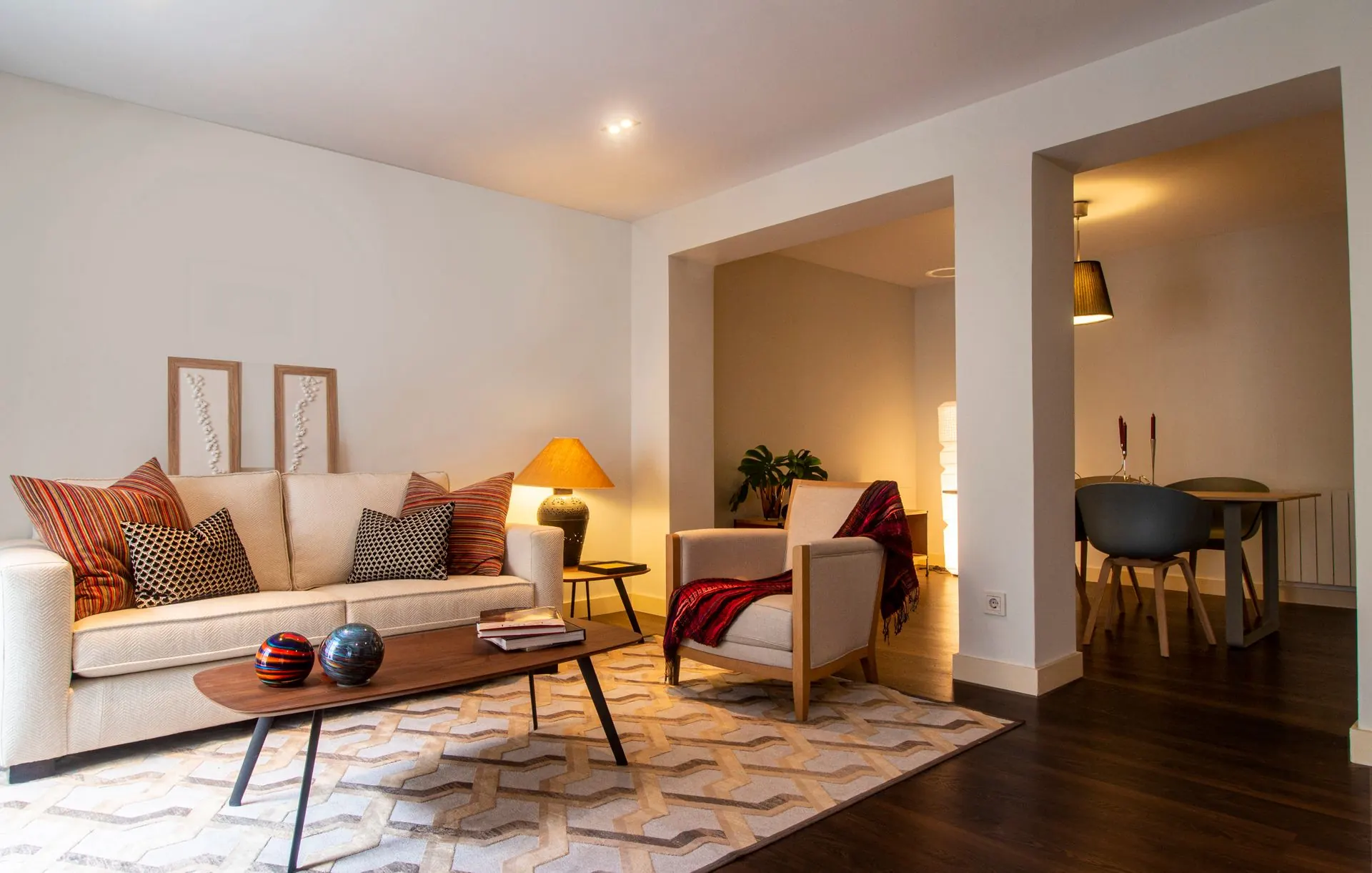 A living room in warm lamp light at the end of the day
